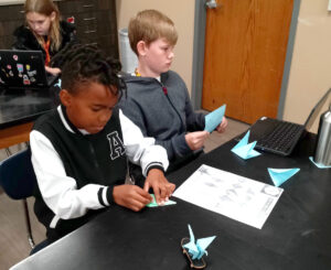 students creating peace cranes