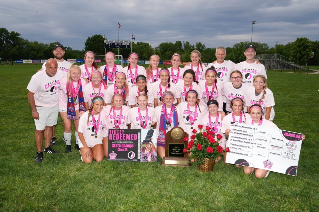 The girls soccer team poses together following the 2022 state championship victory.